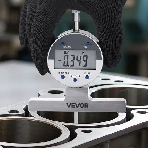Gloved hand holding Beast Depth Micrometer Gauge Digital With 0-22 Inch Range 0.0005 Inch Precision And Four Anvils in machine setting