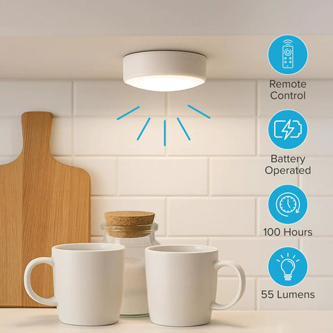 Wireless LED Puck Lights 3 Pack With Remote Control For Under Cabinet Lighting showing single light on in a kitchen setting with mugs and cutting board.