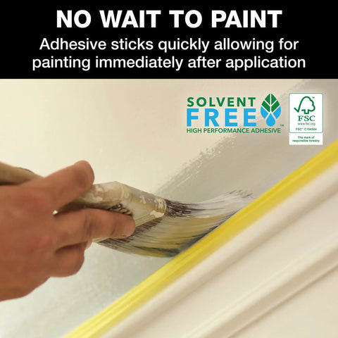 Painter using delicate surface painters tape with PaintBlock technology for sharp lines and no bleed, yellow tape on trim
