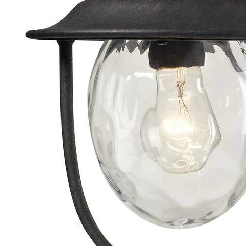 Close-up of the Searsport 15 Inch Outdoor Post Light With Weathered Charcoal Finish showing clear bulb and glass housing.