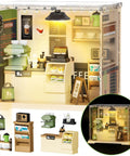 LED Coffee Shop Mini Model Kit for DIY Dollhouse Enthusiasts showing a cozy cafe interior with LED glow, rich accessories included.