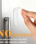Straight Up Clear Cabinet Door Bumpers With Self Adhesive Silicone Rubber Furniture Pads For Fridge And Appliances Dead Nuts Quiet Glide Scratch Resistant Pad Set being applied to a fridge door.