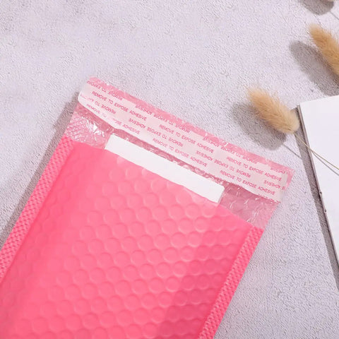 Close-up of 50 Pack Pink Bubble Mailers 16.5x22+4 Inch Self Seal Padded Envelopes with thick bubble interior