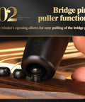Legit Guitar String Winder Bridge Pin Puller Tool For Musicians Detachable Hand Crank shown pulling a bridge pin from guitar.