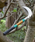 Heavy Duty Grass Sickle For Weeding And Brush Clearing With Carbon Steel Blade And Iron Handle on tree branch