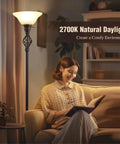 Woman reading beside the Torchiere Floor Lamp With Glass Bowl Shade and Swirl Vane Details, cozy living room setting