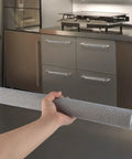 Hand holding Plush 5 Pack Refrigerator Door Handle Covers With Velcro Straps Long 15.74 Inch And Short 6 Inch in kitchen.