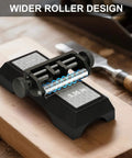 Chisel Sharpening Jig And Honing Guide For Woodworking Chisels And Planes With Pro Grade Angle Control Laser Gauge From 10 To 45 Degrees CNC Machined Jaws For 0.05 Degree Bevel Replication Fits 0.1 To 2.8 Inch Blades Black on a wooden bench showing wider roller design.