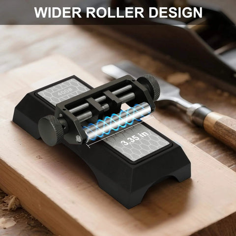 Chisel Sharpening Jig And Honing Guide For Woodworking Chisels And Planes With Pro Grade Angle Control Laser Gauge From 10 To 45 Degrees CNC Machined Jaws For 0.05 Degree Bevel Replication Fits 0.1 To 2.8 Inch Blades Black on a wooden bench showing wider roller design.