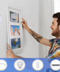 Man using Damage Free Picture Hangers 100 Pack Adhesive Strips No Nails Hooks For Home Kitchen Bathroom Door Closet White for frame