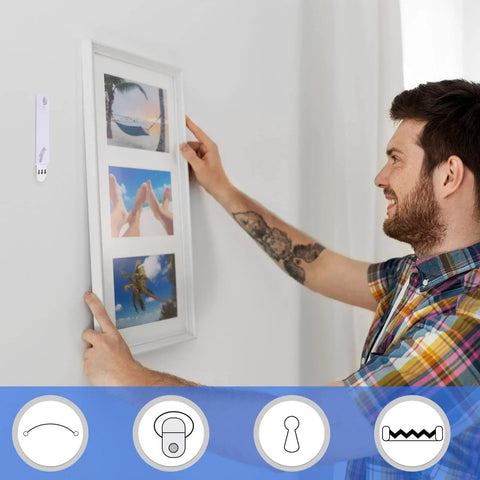 Man using Damage Free Picture Hangers 100 Pack Adhesive Strips No Nails Hooks For Home Kitchen Bathroom Door Closet White for frame