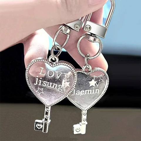 Heavy Duty Silver Lobster Claws And Swivel Snap Hooks With Key Rings, heart-shaped charms engraved 'LOVE' and names.