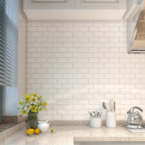 Peel And Stick 3D Brick Wall Panels White Faux Paneling Waterproof Self Adhesive Wallpaper For Bedroom Bathroom Kitchen And Fireplace Realistic Texture No Sweat Easy Install With 10.65 Sq Feet Coverage installed in a kitchen with countertop accessories.