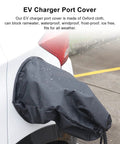 Hella Solid EV Charger Port Cover With A Super Snug Magnetic Seal And A Lightweight Foldable Shape To Keep Your Electric Cord Dry And Fully Shielded From Gnarly Weather Outdoors on a car with water droplets.