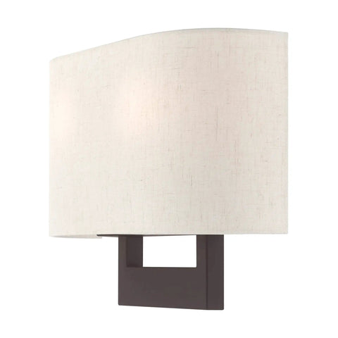 Bronze Wall Sconce With Contemporary Design, Sleek modern lighting for living rooms and hallways, featuring oatmeal shade