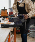 Worker using the Beefy 2-Inch Receiver Hitch Vise Mount For Bench Work, Heavy Duty Grinder Stand And Trailer Hitch Vise Plate