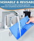 Person rinsing Six Pack Wet Dry Filter Bags For Stinger 2.5-5 Gallon Shop Vac under running water in sink