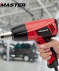 Person holding Beefy Heavy Duty Industrial Electric Heat Gun With Quick Change Element, Dual 1200F And 600F Temps, 1560W 120V