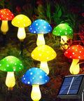 8 Pack Solar Mushroom Lights For Garden Decor with 8 Modes Waterproof Outdoor Lamps, multicolor glow in nighttime garden scene