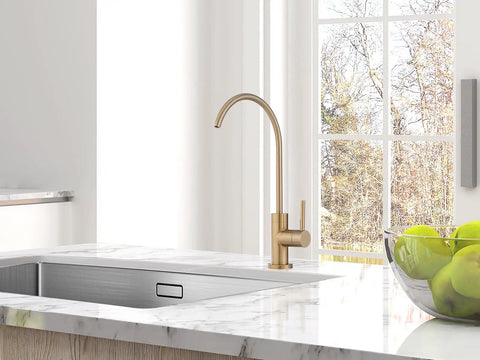 Top Shelf Champagne Bronze Kitchen Water Filter Faucet Built To Drop Right Into Most Reverse Osmosis Systems Drawing Crisp Water With Zero Stress Using Lead Free Stainless Steel And A Rock Solid Drip Free Cartridge on marble countertop with apples.