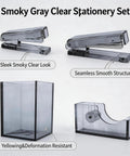 Smoke Grey 4 Piece Acrylic Office Desk Gear Kit with staplers, pen cup, and tape dispenser, transparent desk organizer set
