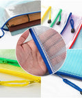 Slick Clear Plastic Zipper Document Bags Pack of Fifteen in Five Bright Shades With No Sweat Closure and Handy Wrist Loop for Receipts Checks Paperwork and All Your Gear, showcasing colorful zippers and hand-held use.