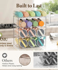 Colorful tumblers on stackable water bottle organizer rack for cabinet storage with multi tier tumbler holder and anti slip grooves.