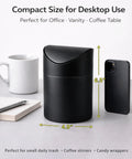 Tiny Matte Black Desktop Trash Can With Lid For Office Desk And Vanity 1.5 Liter Countertop Waste Bin next to a phone and coffee mug