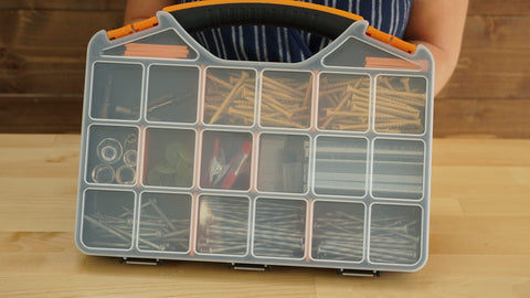 Person holding 18 Compartments Hardware Gear Organizer Box With Removable Dividers And Accessible Hinged Lid for tool storage