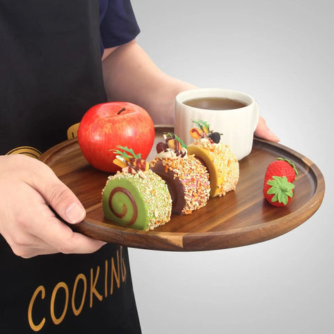 12 Inch Round Acacia Wood Serving Tray with desserts, apple, and coffee cup, natural kitchen dish holder for dining.
