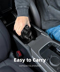 Person placing NACS To CCS1 EV Charger Adapter in car console for easy portability, supports fast charging up to 500A, 1000V.