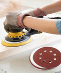 Using random orbital sander with 110 Pack 5 Inch 8 Hole Sanding Discs Set With Hook And Loop Aluminum Oxide Pads on wood