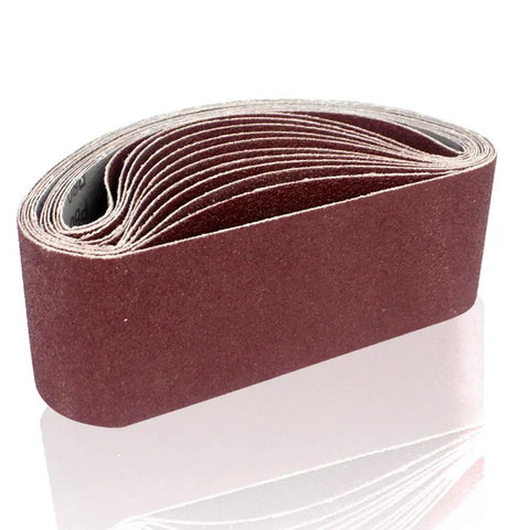 Rugged 3X21 Inch Sanding Belts, 12 Pack 80 Grit Aluminum Oxide Open Coat, stacked rolls against white background