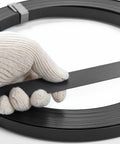 Heavy Duty Steel Strapping Coil 3 4 Inch By 02 Inch By 1640 Ft Metal Banding Roll with a hand holding the strap.