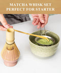 Pink Matcha Whisk Set with Chasen Holder, Ceramic Stand, Bamboo Scoop, and Fine Mesh Sifter in use on table.