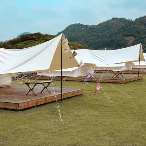 8 Pack 4mm Reflective Tent Guylines With Aluminum Adjuster Tensioner Ultralight Camping Ropes securing white tarps on grass