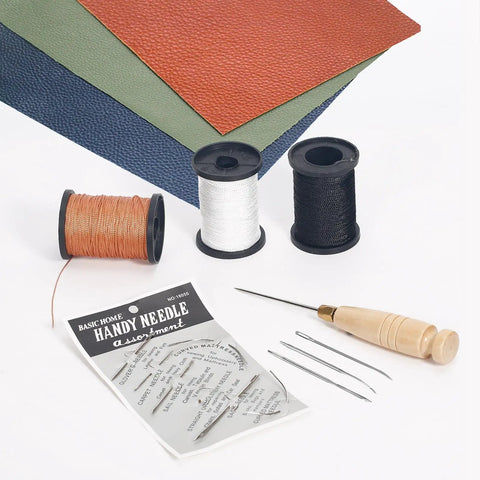 Three Spool Nylon Thread Sewing Kit With Pro Grade 3 Spools Of 80 Yards In Black White And Brown Heavy Duty Needles Set Five Straight And Two Curved Sewing Awl Ideal For Upholstery Leather Shoes And DIY Crafts, featuring threads and needles with awl on fabric.