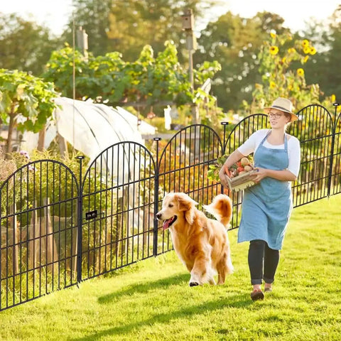 Woman and dog by Tall Garden Fence With Gate 40 Inches High By 26 Feet Long 12 Panels Heavy Duty Metal No Dig Fence For Yard