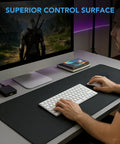 Person using Extra Large Gaming Mouse Pad 31.5 By 15.7 Inch Desk Mat With Non Slip Rubber Base in gaming setup with keyboard