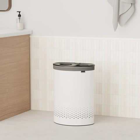 Big Ol Two-Section Laundry Hamper With Removable Inner Bags, Quick-Drop Opening in a bathroom setting