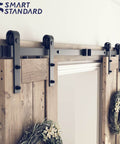 Close-up of installed Six Foot Double Barn Door Hardware Kit For Home Use Sliding Door Track That Glides Smooth And Quiet DIY