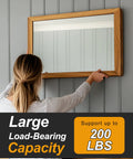 Person hanging large mirror using Beefy Heavy Duty 30 Inch Aluminum French Cleat Set 2 Pairs Interlocking Z Clips Bar Hangers