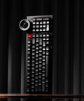 98 Key Silent Mechanical Keyboard With Hot Swappable RGB Lighting And Tri Mode Wireless Setup Giving You A Smooth As Butter Typing Experience Straight Up Built For Gaming Or Daily Grind Use In Night Ink shown from the front on a dark background.