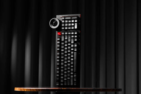 98 Key Silent Mechanical Keyboard With Hot Swappable RGB Lighting And Tri Mode Wireless Setup Giving You A Smooth As Butter Typing Experience Straight Up Built For Gaming Or Daily Grind Use In Night Ink shown from the front on a dark background.