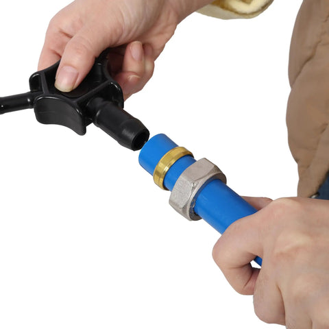 Hand connecting fittings to Boss Grade Blue Air Compressor Piping Tube 3/4 Inch X 200 Feet for tight seal setup.
