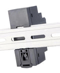 Straight Up Reliable 15 Watt 12 Volt Din Rail Switching Power Supply 1.25 Amp mounted on metal DIN rail, close-up view, showcasing connection.