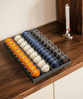 Nespresso Vertuo Pod Drawer Organizer For Countertop, Fits All Vertuo Capsules, shown with capsules on a wooden counter