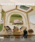 Interior of spacious Quick Setup Camping Tent With Air Beams For Easy Outdoor Shelter No Poles To Mess With All Season Waterproof 210D Oxford Fabric Dual Action Pump Included For Fast Setup In Under 5 Minutes showing living space with chairs and table.
