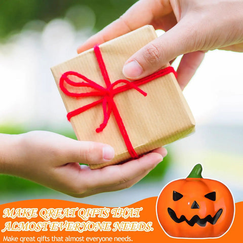 Person handing a wrapped gift with a red ribbon, featuring Top Notch Halloween Bathroom Glow Up Dope Ghost Pumpkin Toilet Seat Bolt Cover Cap Set.