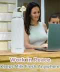 Portable Stainless Steel Vacuum Insulated Breastmilk Cooler Bottle Keeps Nursing Milk Ice Cold For Thirty Six Hours With Reusable Travel Chiller And Grab Bag Essential on wooden table with a woman and child.